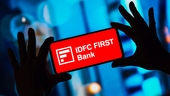 IDFC First Bank shares inch up despite Q1 profit dip