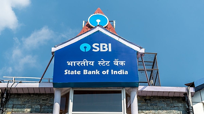 SBI is expected to report flat Q1 FY26 profit amid margin pressure. Loan growth and asset quality are likely to remain steady.