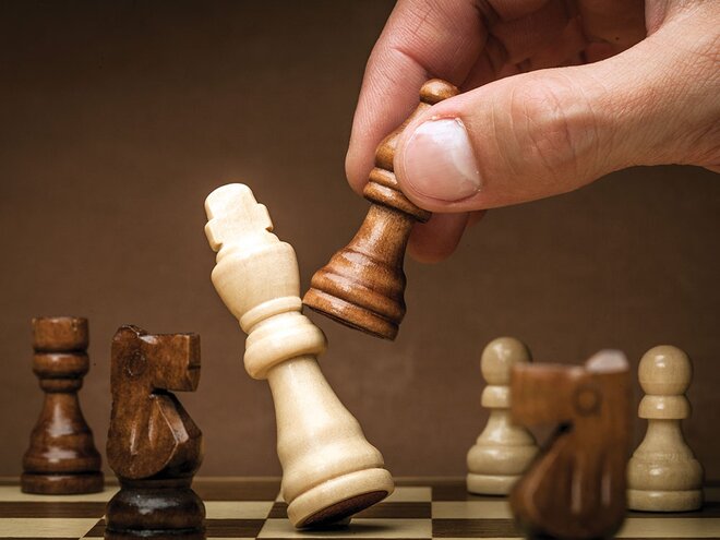 Premium Photo  Play national chess with business compass concept